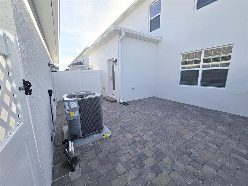2376 Rider Rain Lane Apopka, FL 32703 - Photo 24 of 27 a view of an empty room with windows