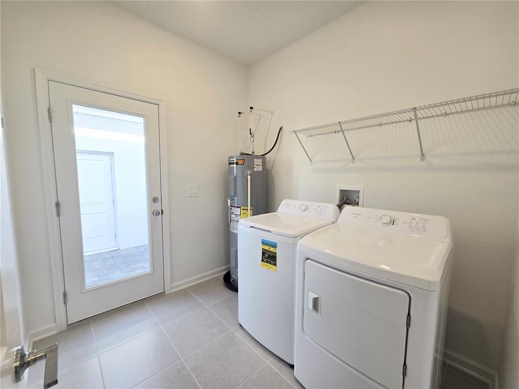 2376 Rider Rain Lane Apopka, FL 32703 - Photo 10 of 27 a utility room with dryer and washer
