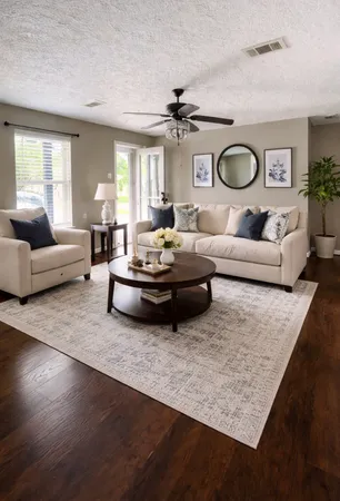 a living room with furniture and a large window