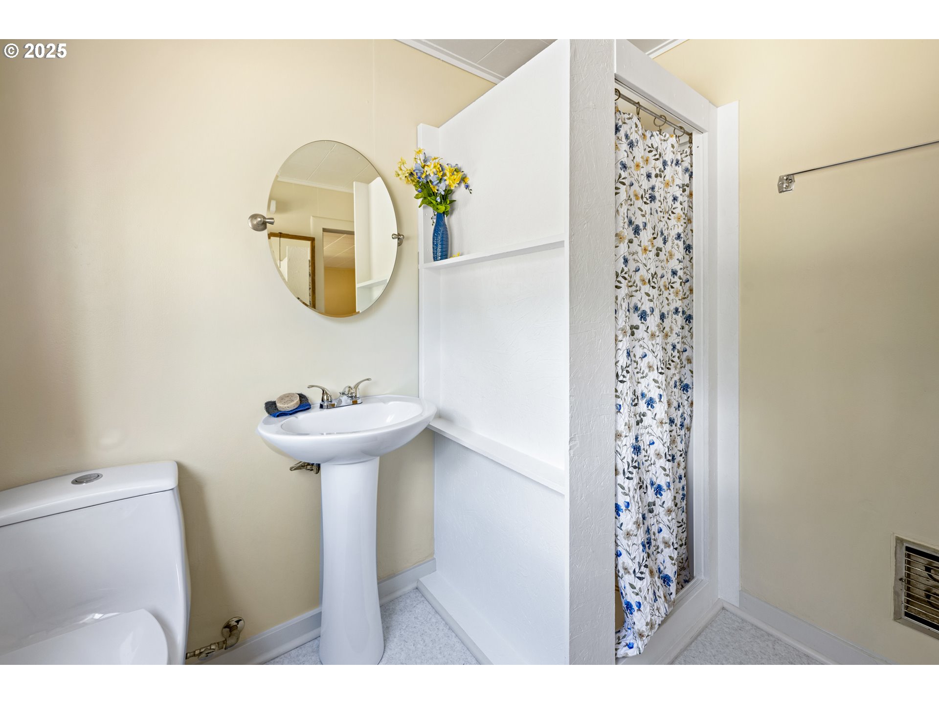 652 Chapman Street Gilchrist, OR 97737 - Photo 16 of 29 a bathroom with a sink a toilet and a mirror