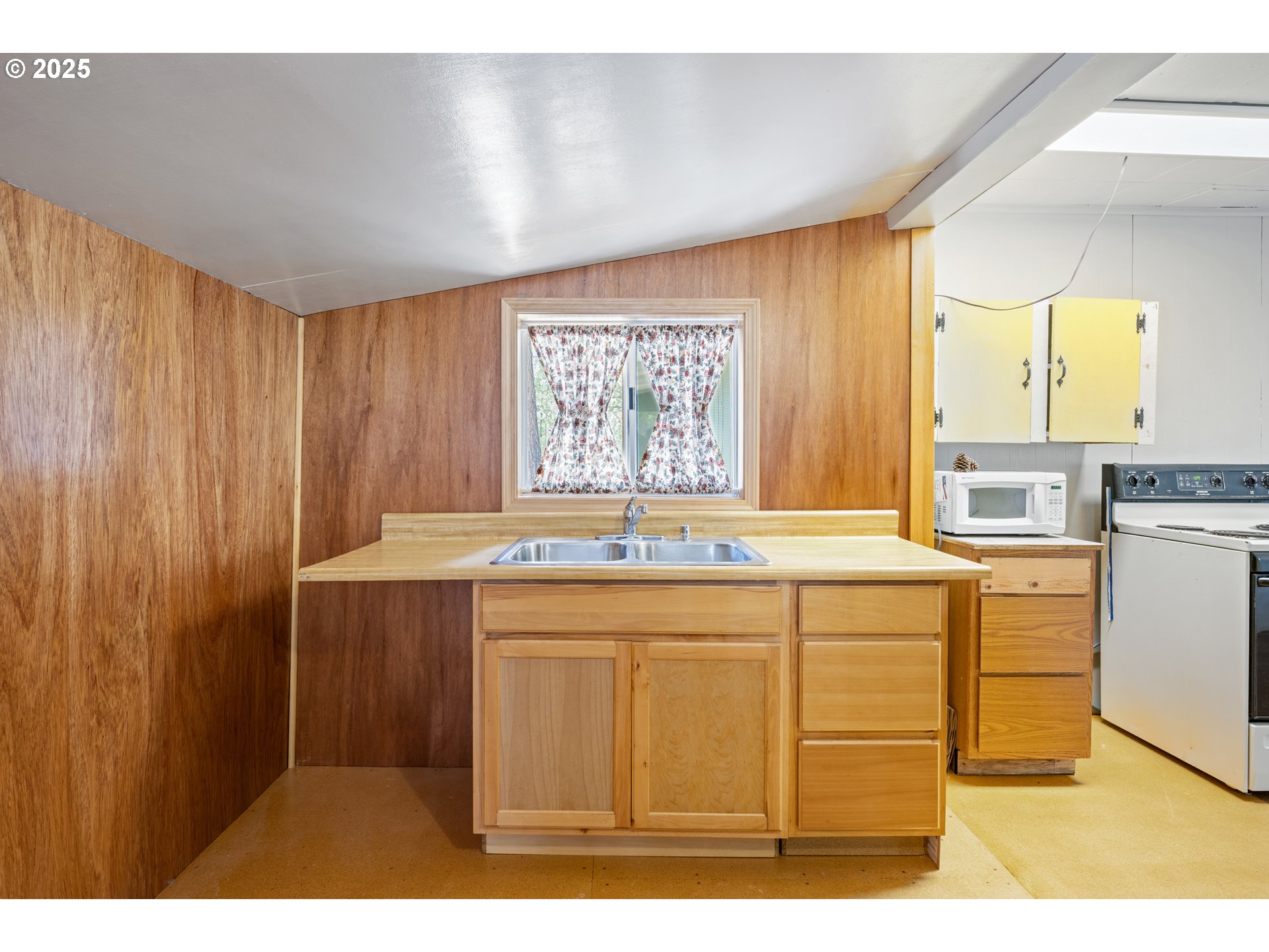 652 Chapman Street Gilchrist, OR 97737 - Photo 10 of 29 a kitchen with a sink and cabinets