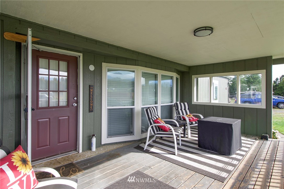 411 Spencer Road Sequim, WA 98382 - Photo 10 of 40 a living room with furniture and a window
