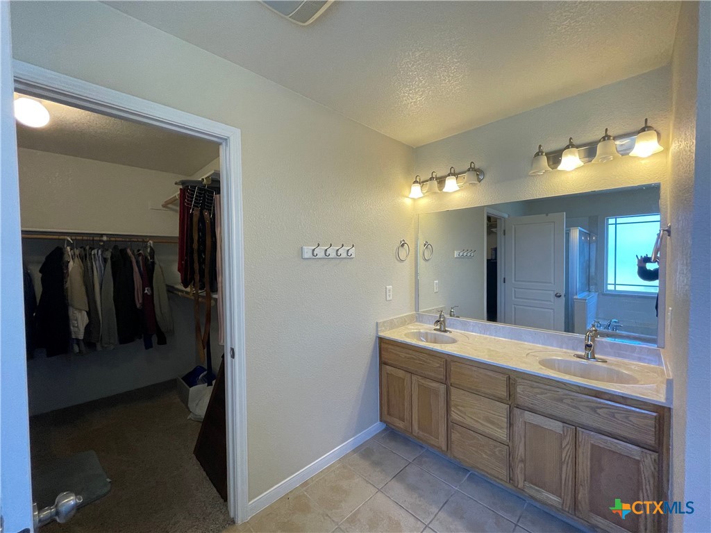 170 County Road 4709 Kempner, TX 76539 - Photo 14 of 24 Master Bathroom with Dual sinks and Tile Flooring
Texas Real Estate Sales, Leah Caruthers