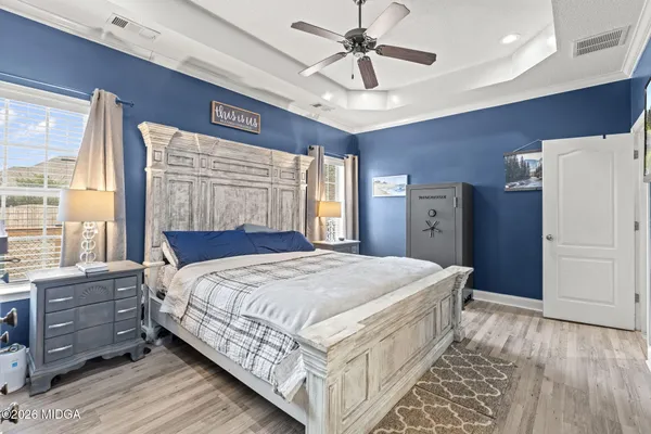 a bedroom with a large bed and a window