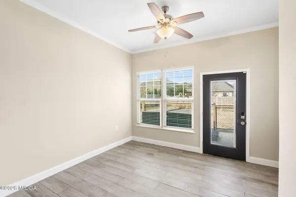 a view of an empty room with a window