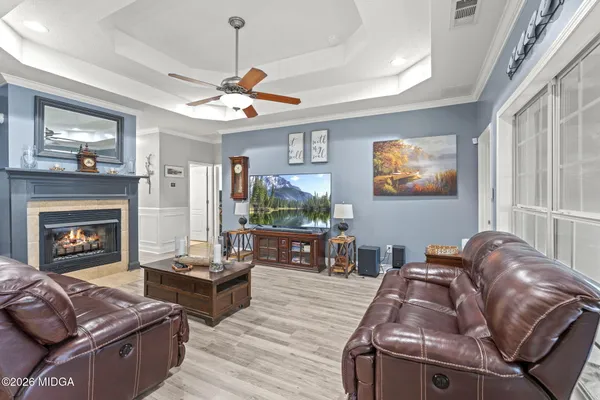 a living room with furniture and a fireplace