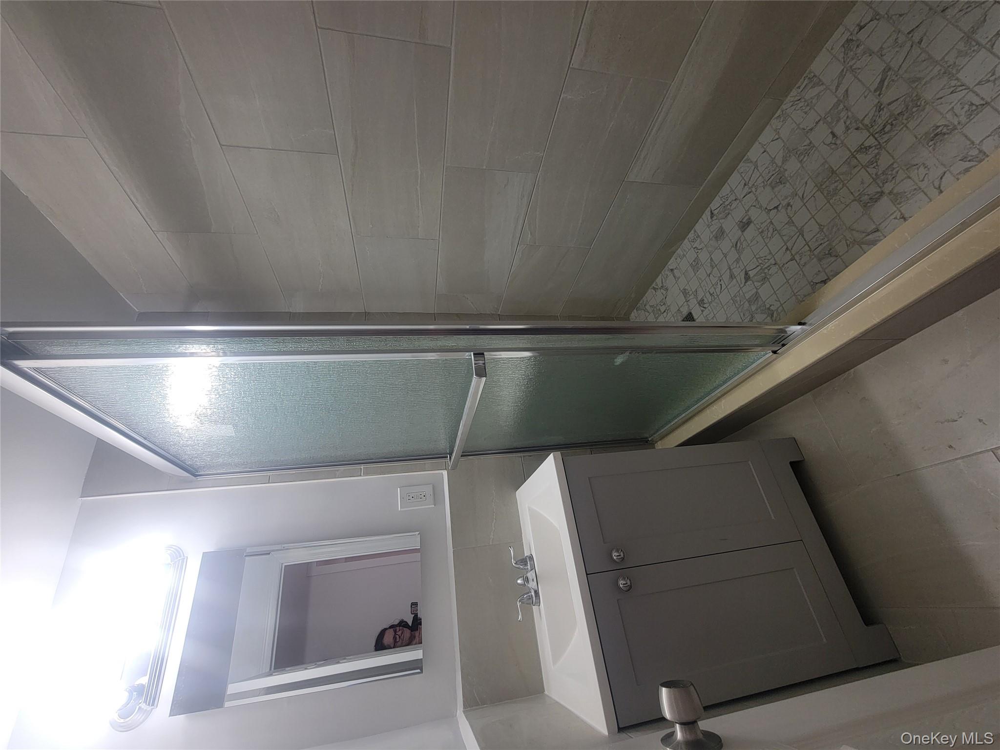 7 Fordham Hill Ovl, Unit 16C Bronx, NY 10468 - Photo 12 of 17 a bathroom with a sink a toilet and shower