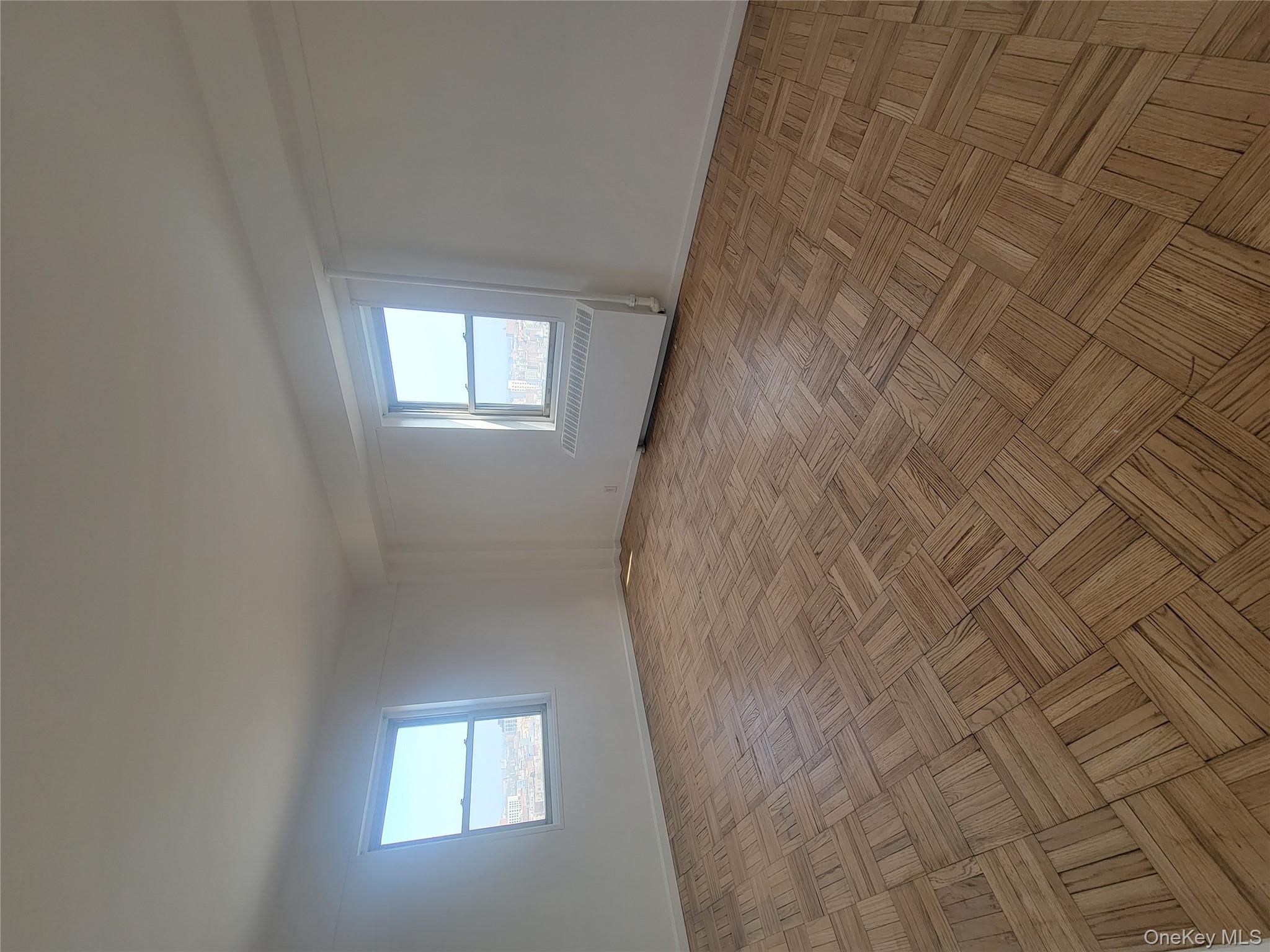 7 Fordham Hill Ovl, Unit 16C Bronx, NY 10468 - Photo 14 of 17 an empty room with windows