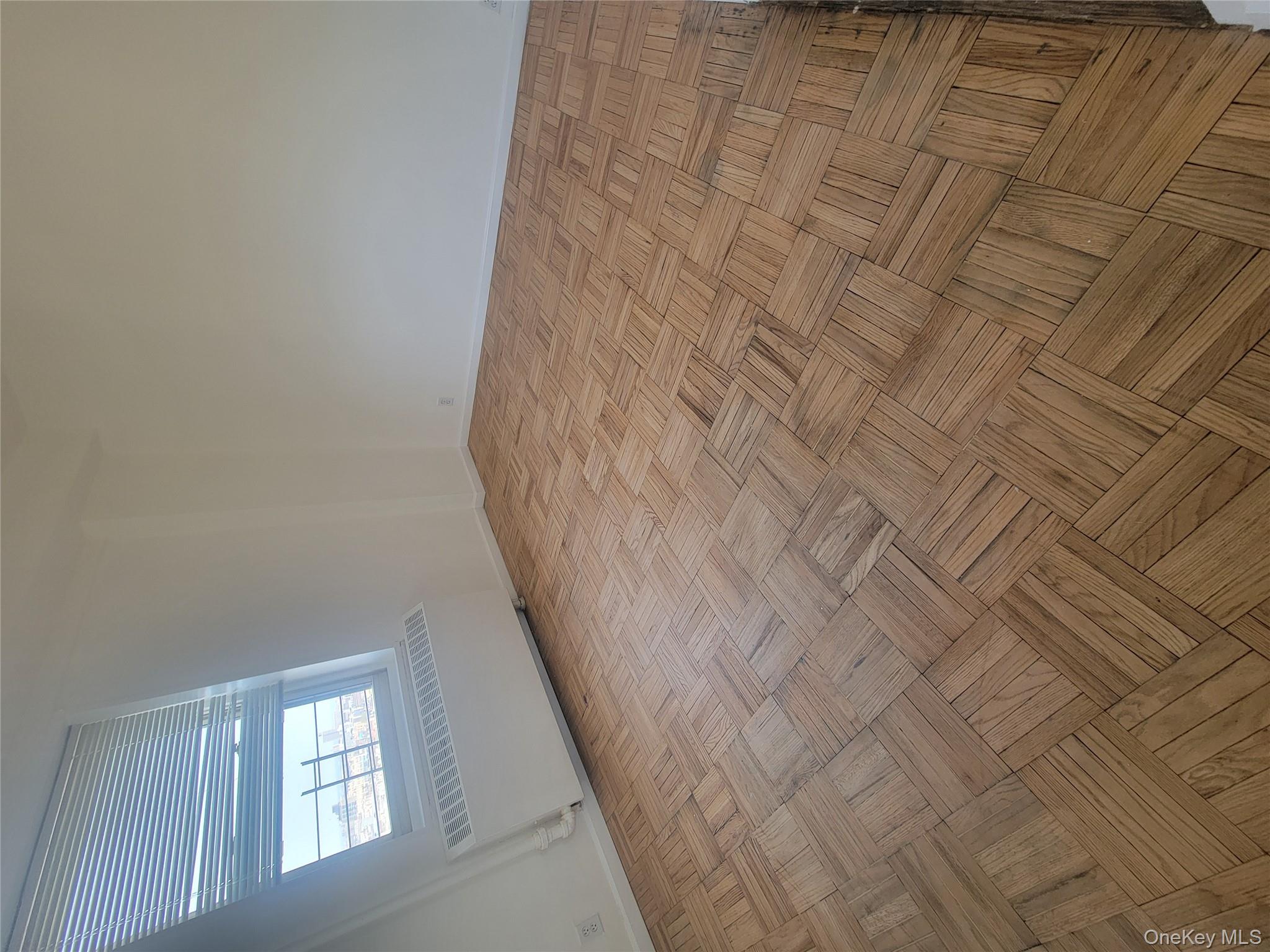 7 Fordham Hill Ovl, Unit 16C Bronx, NY 10468 - Photo 10 of 17 an empty room with windows