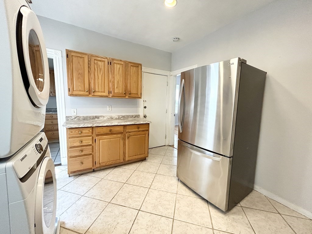 18 Eastman Street, Unit 2 Boston, MA 02125 - Photo 2 of 9 a kitchen with stainless steel appliances granite countertop a refrigerator and a stove