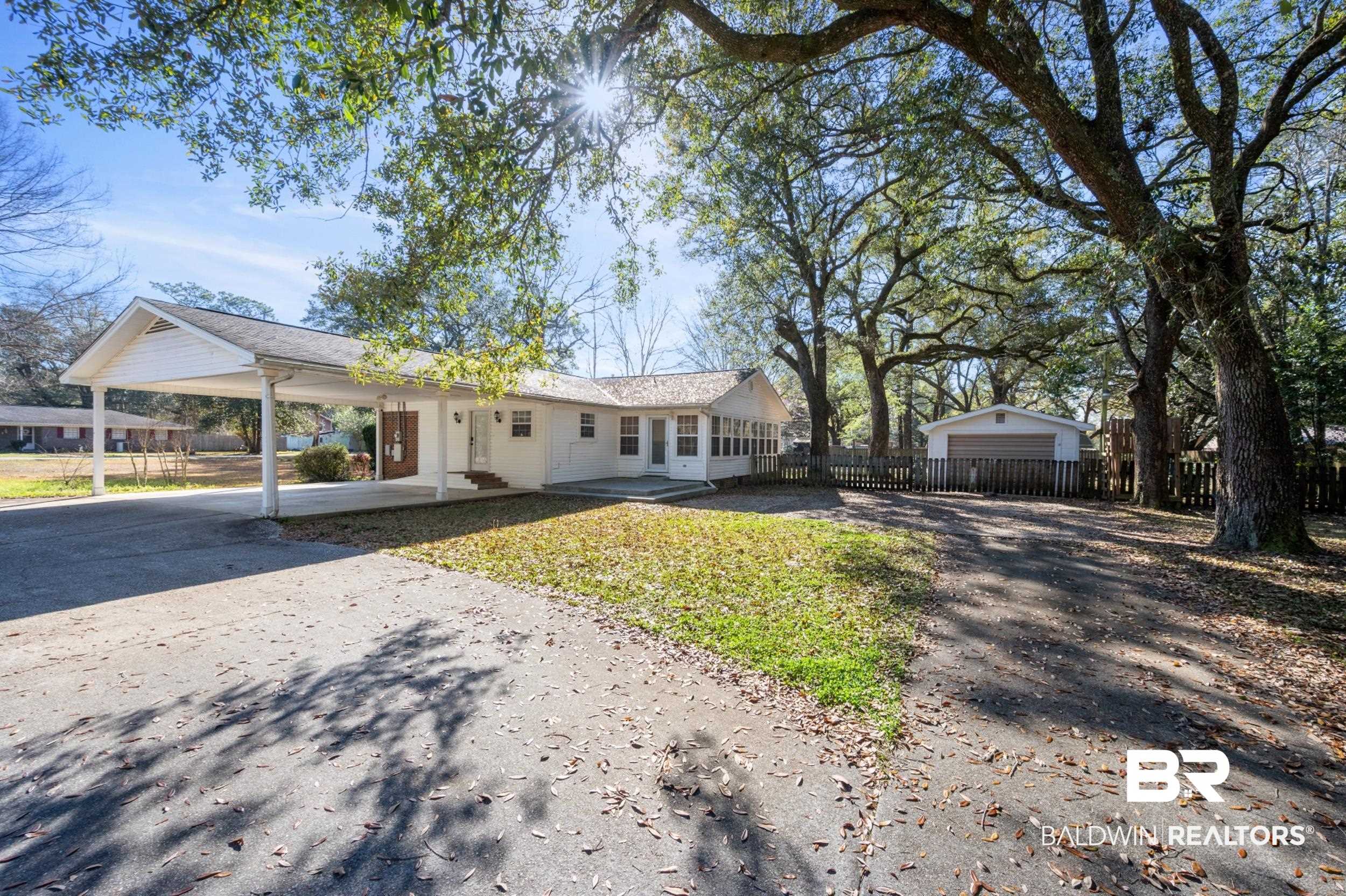 809 Moog Avenue Bay Minette, AL 36507 - Photo 6 of 33 View of front facade featuring an attached carport and driveway