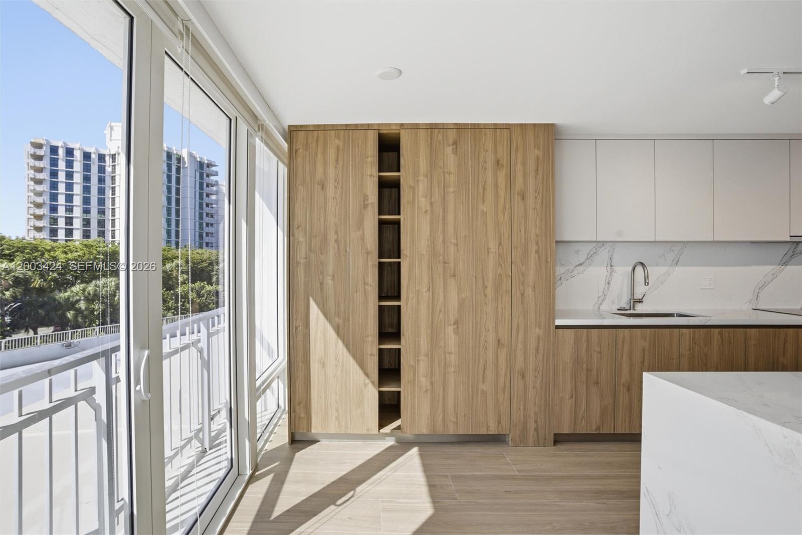 600 Grapetree Drive, Unit 4BS Key Biscayne, FL 33149 - Photo 11 of 75 a view of a kitchen with wooden floor and staircase