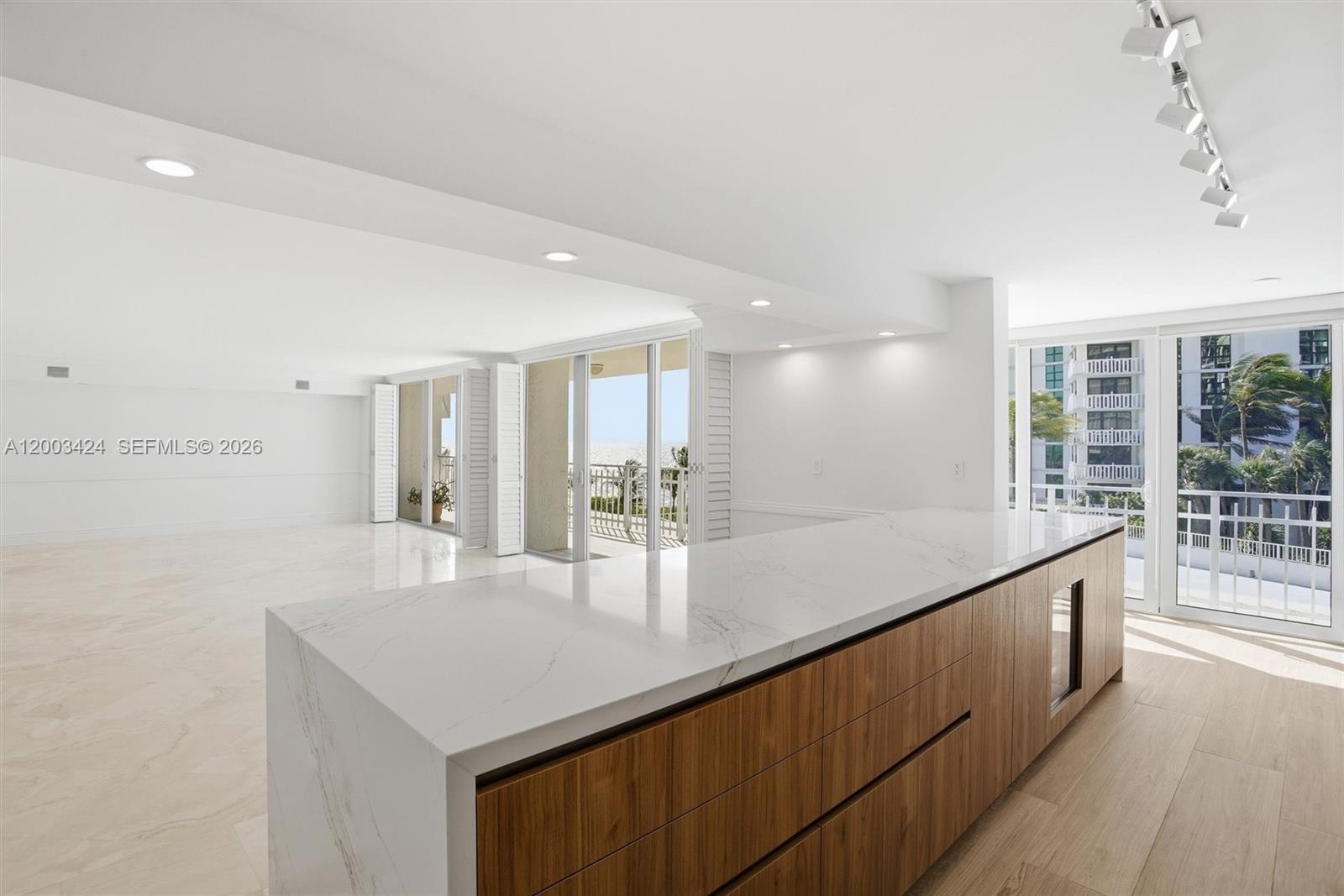 600 Grapetree Drive, Unit 4BS Key Biscayne, FL 33149 - Photo 14 of 75 a kitchen with stainless steel appliances granite countertop a sink counter space and cabinets