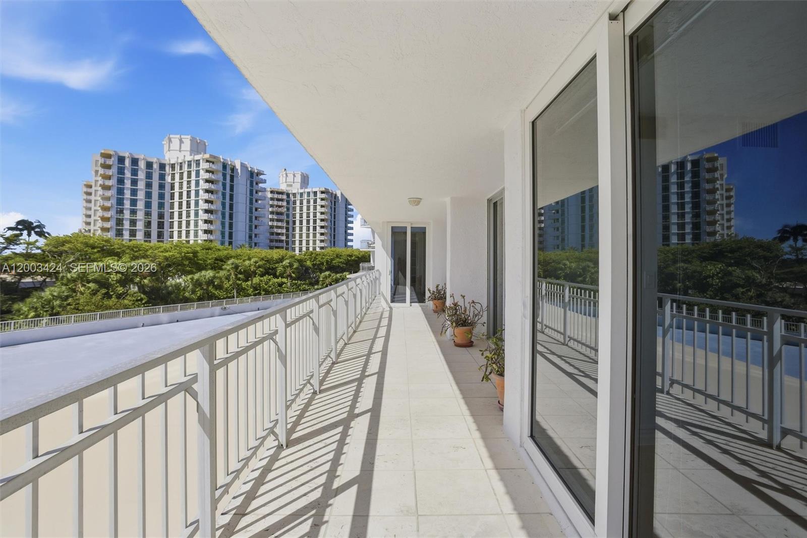 600 Grapetree Drive, Unit 4BS Key Biscayne, FL 33149 - Photo 20 of 75 a view of balcony with floor to ceiling window and stairs