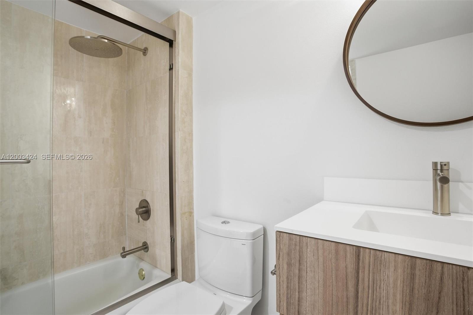 600 Grapetree Drive, Unit 4BS Key Biscayne, FL 33149 - Photo 28 of 75 a bathroom with a sink and a mirror