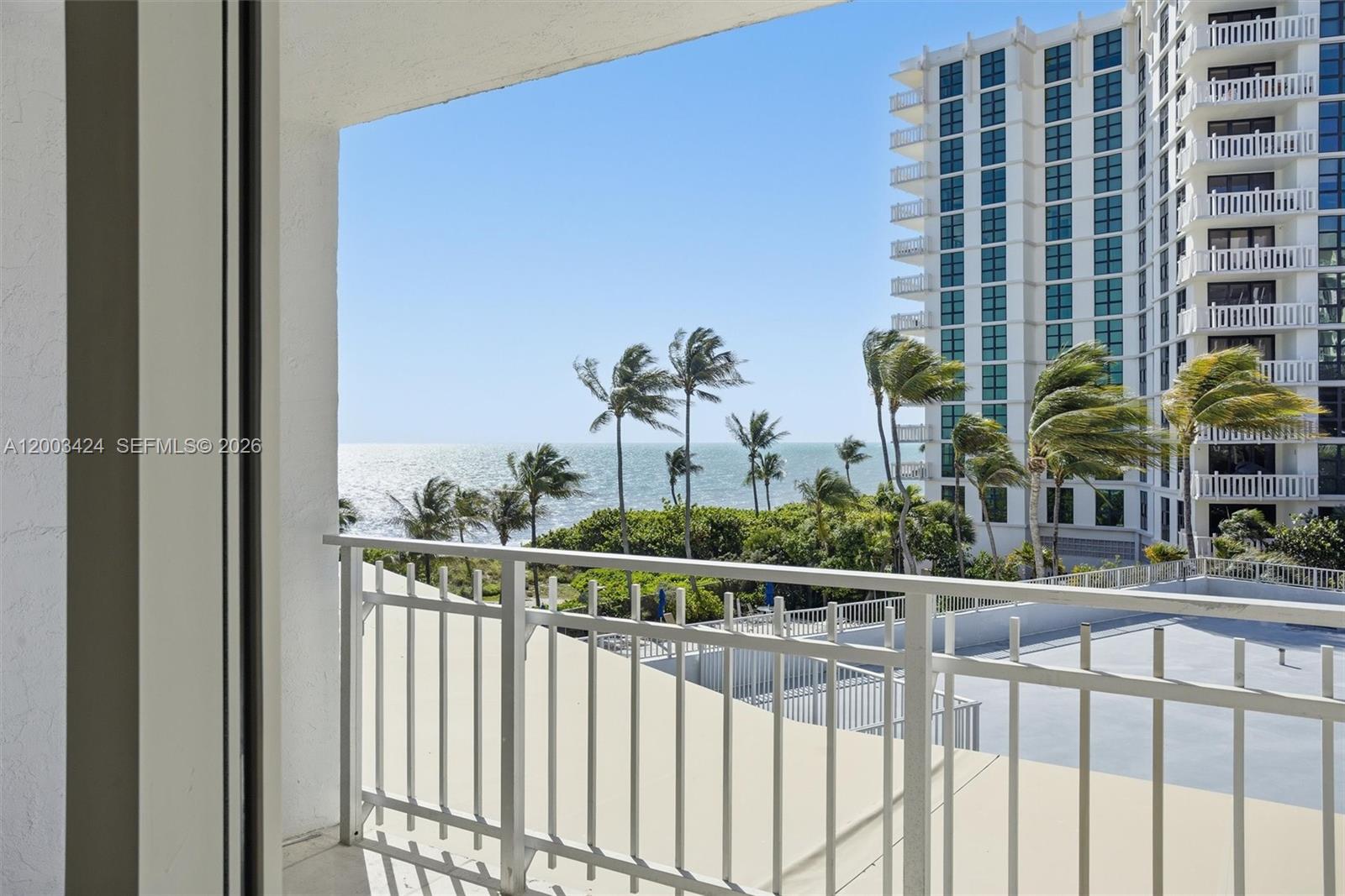 600 Grapetree Drive, Unit 4BS Key Biscayne, FL 33149 - Photo 40 of 75 a view of a balcony with a floor to ceiling window