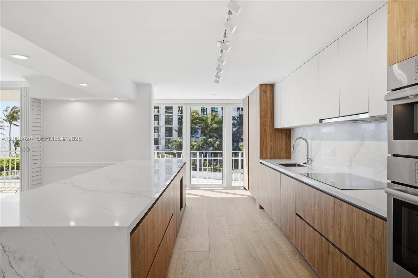600 Grapetree Drive, Unit 4BS Key Biscayne, FL 33149 - Photo 4 of 75 a kitchen with a sink appliances and cabinets