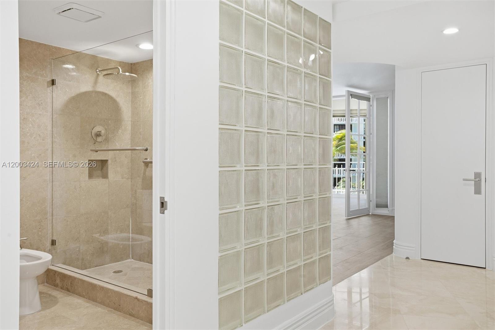 600 Grapetree Drive, Unit 4BS Key Biscayne, FL 33149 - Photo 44 of 75 a bathroom with a shower and a sink