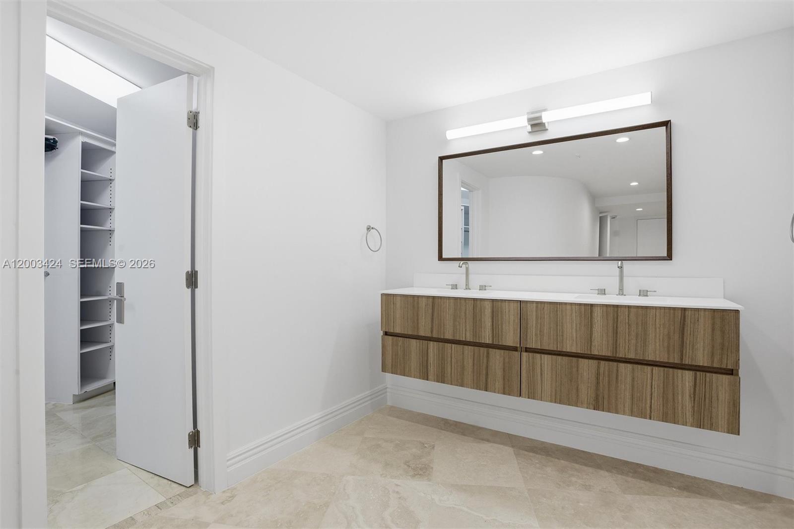 600 Grapetree Drive, Unit 4BS Key Biscayne, FL 33149 - Photo 46 of 75 a bathroom with a mirror