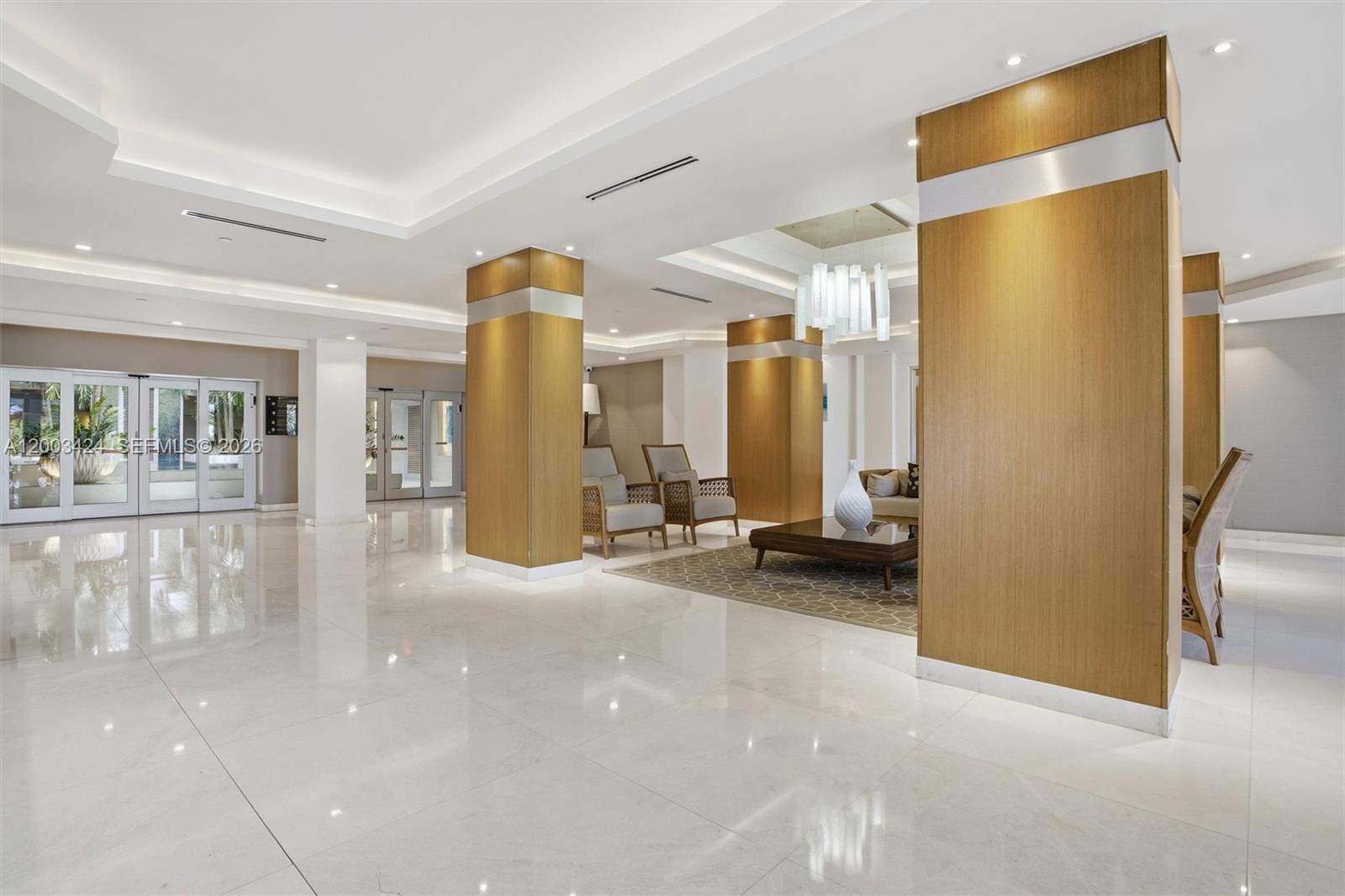 600 Grapetree Drive, Unit 4BS Key Biscayne, FL 33149 - Photo 58 of 75 a view of a hallway with furniture and a refrigerator