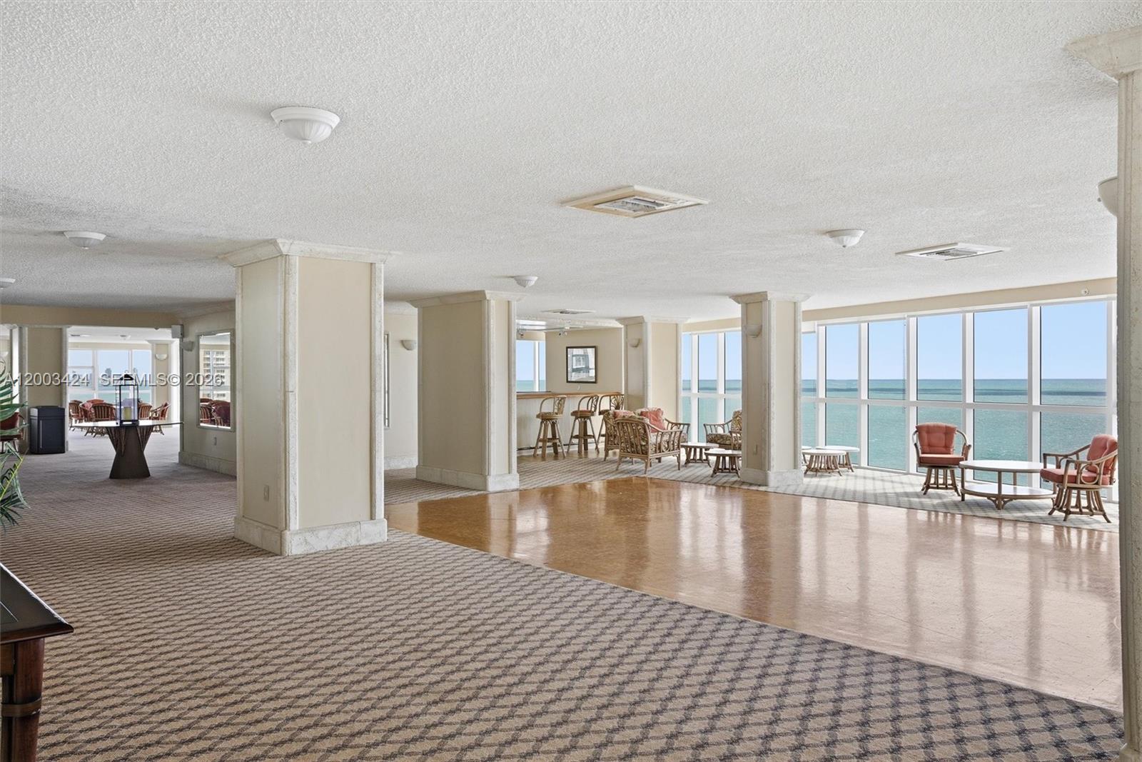 600 Grapetree Drive, Unit 4BS Key Biscayne, FL 33149 - Photo 69 of 75 a lobby with furniture and floor to ceiling windows