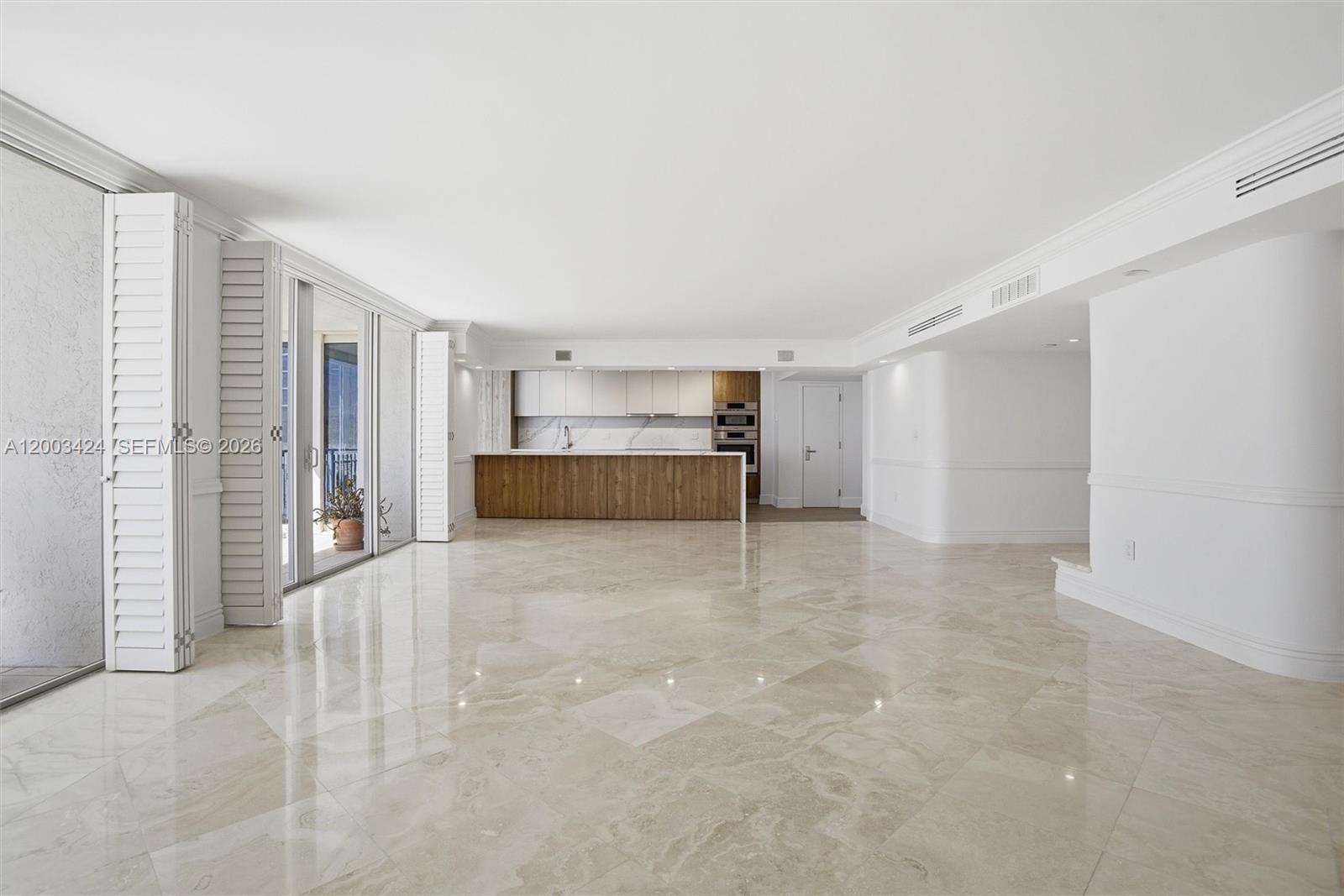 600 Grapetree Drive, Unit 4BS Key Biscayne, FL 33149 - Photo 9 of 75 a view of an empty room with a kitchen