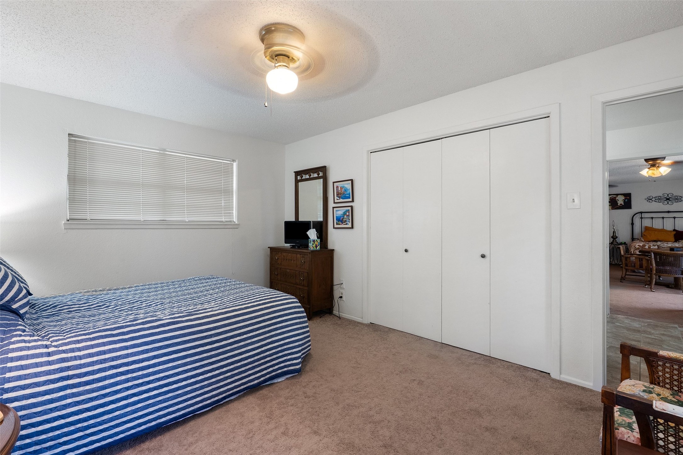 141 Perry Lane Kingsland, TX 78639 - Photo 32 of 40 Well-lit sleeping quarters with ample storage and soft underfoot carpeting.