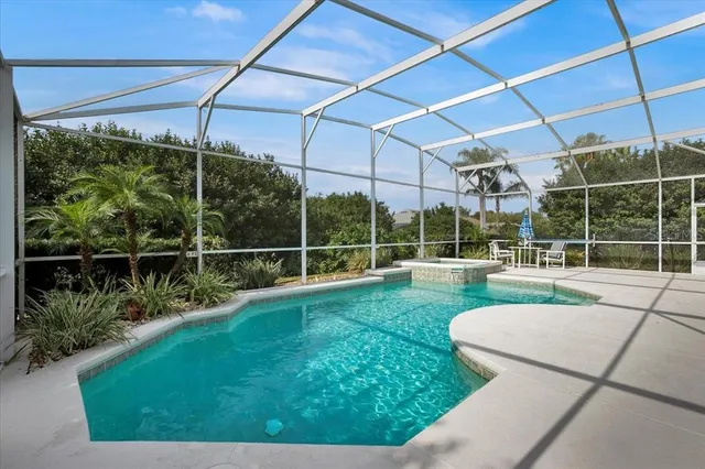 a view of a backyard with swimming pool