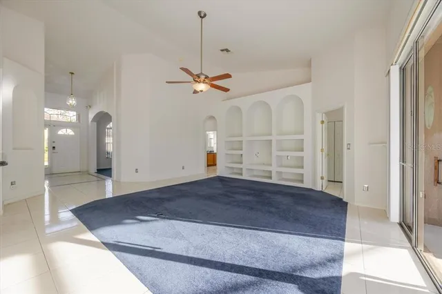 a view of a hallway with wooden floor and entryway