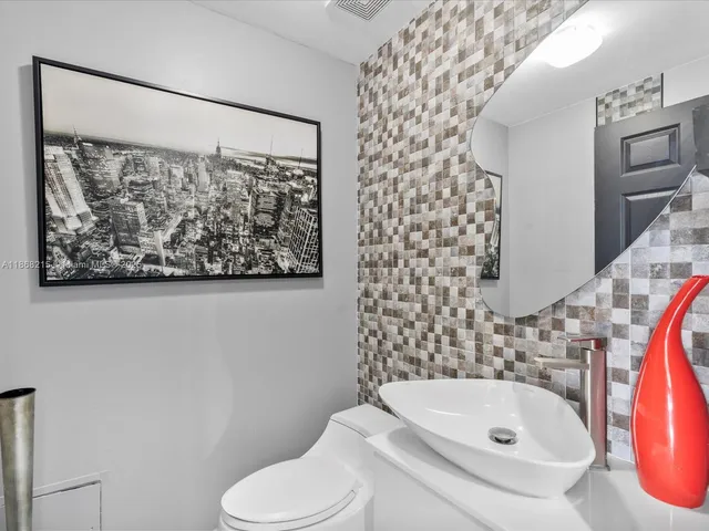 a bathroom with a sink and toilet