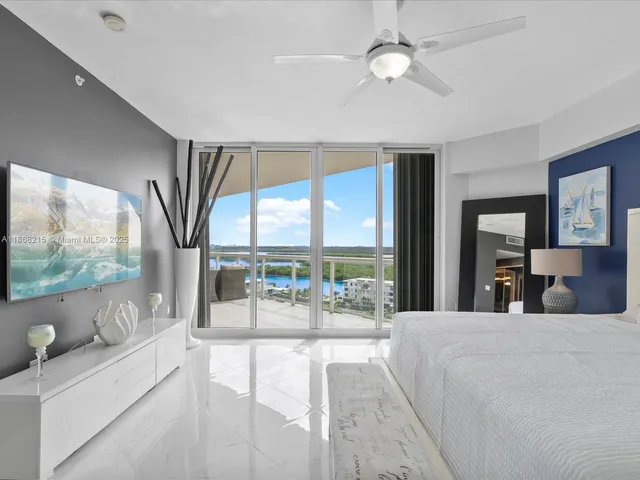 a living room with large window and a couch