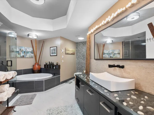 a living room with furniture and a large mirror