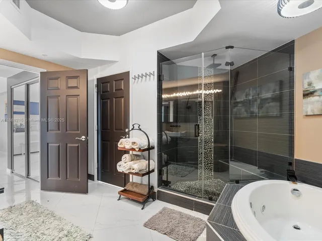 a bathroom with a bathtub and a shower