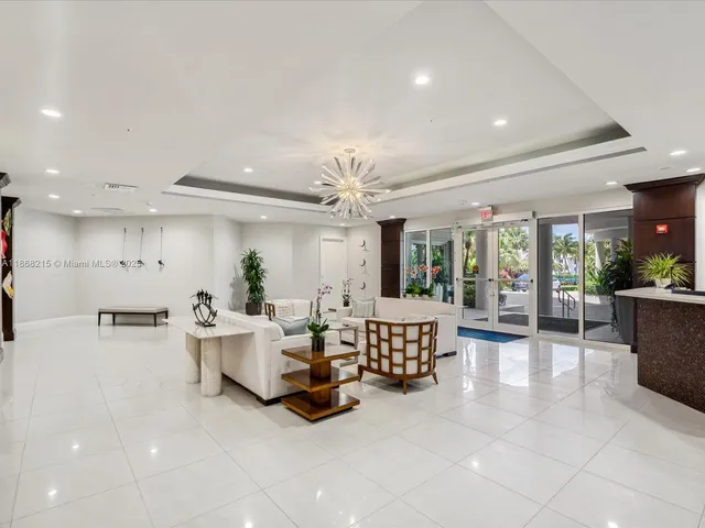 a large living room with furniture and a flat screen tv