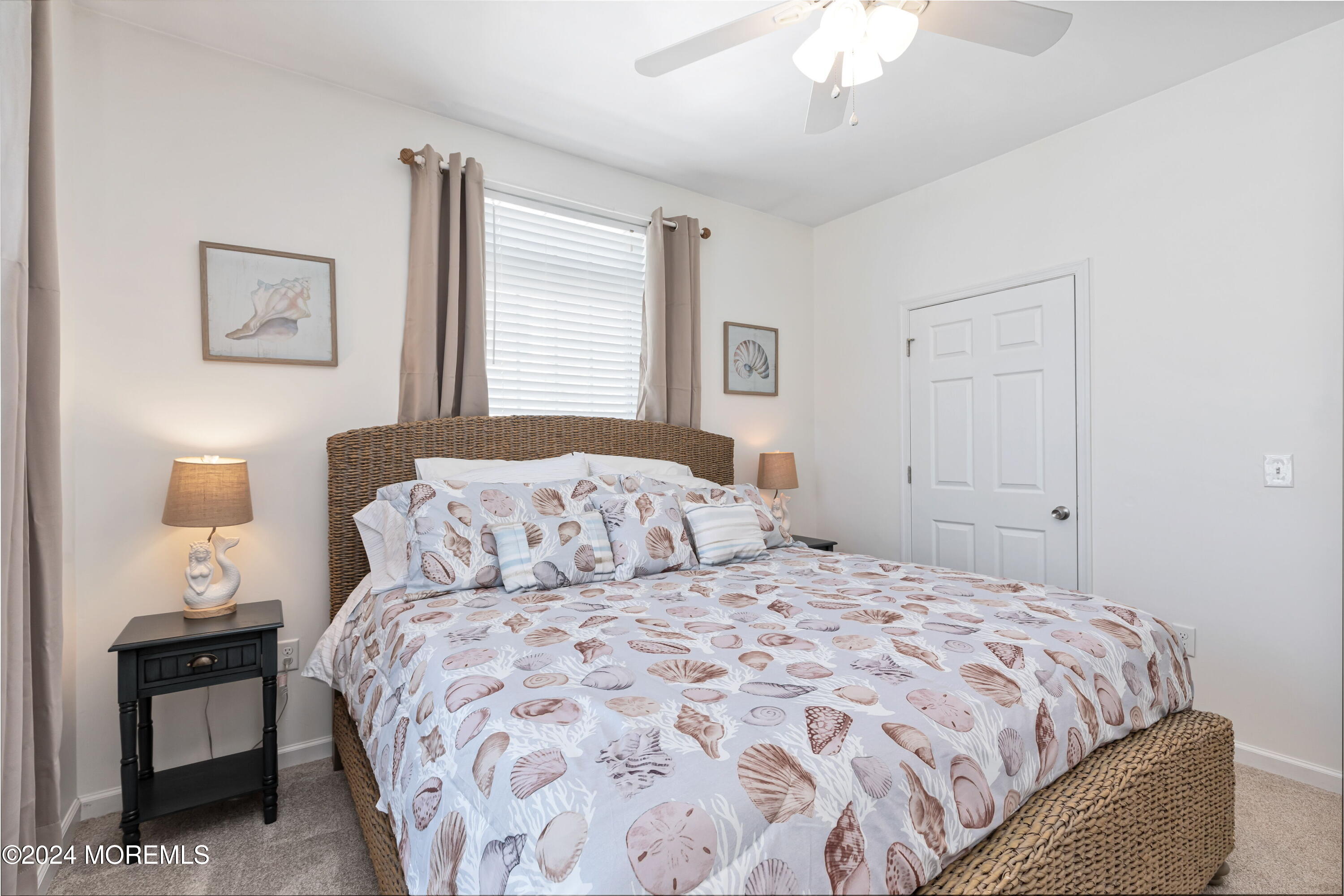 145 Flamingo Road Tuckerton, NJ 08087 - Photo 17 of 43 a bedroom with a large bed and a chandelier