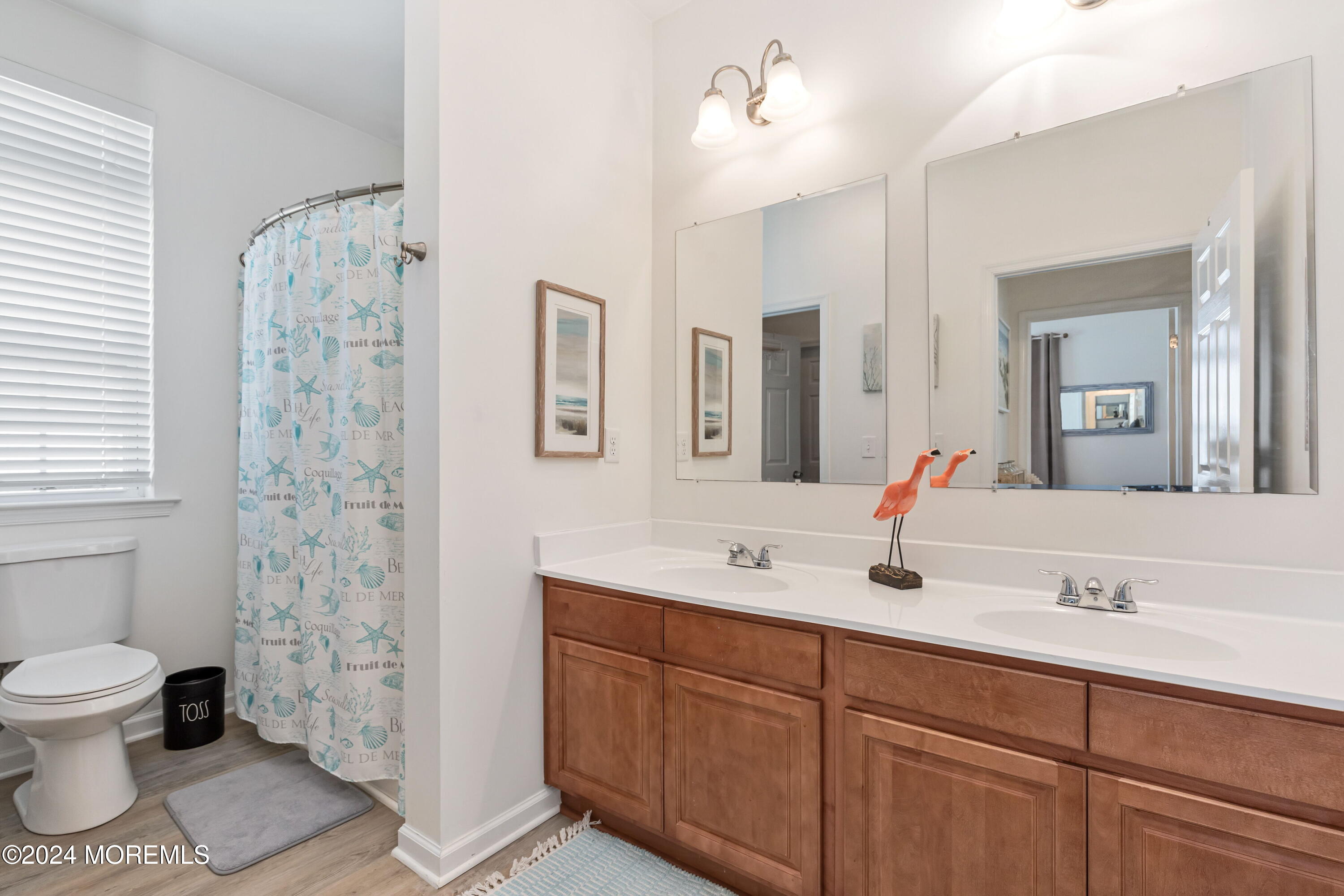145 Flamingo Road Tuckerton, NJ 08087 - Photo 18 of 43 a bathroom with a sink and a mirror