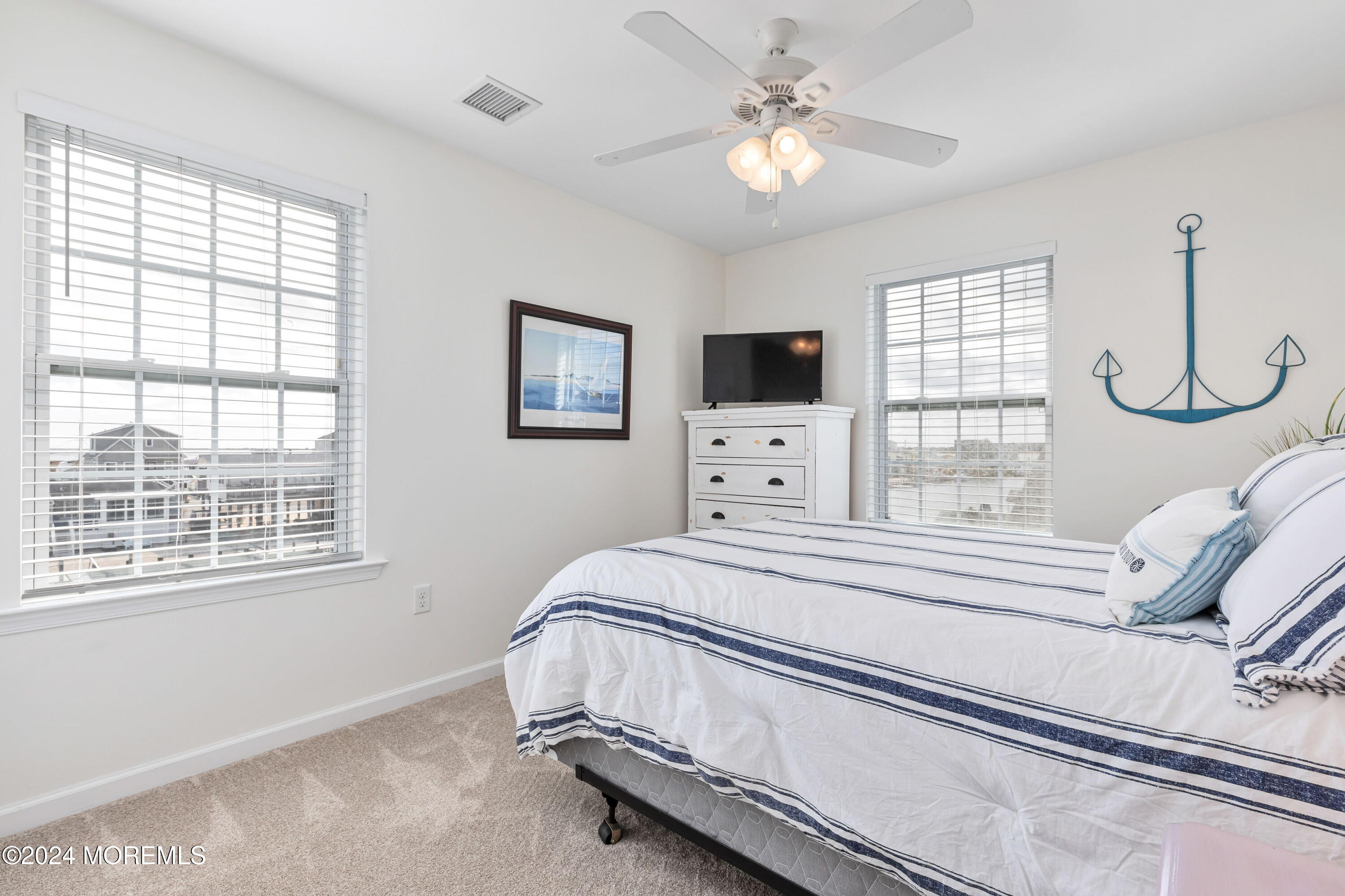145 Flamingo Road Tuckerton, NJ 08087 - Photo 21 of 43 a bedroom with bed and a window