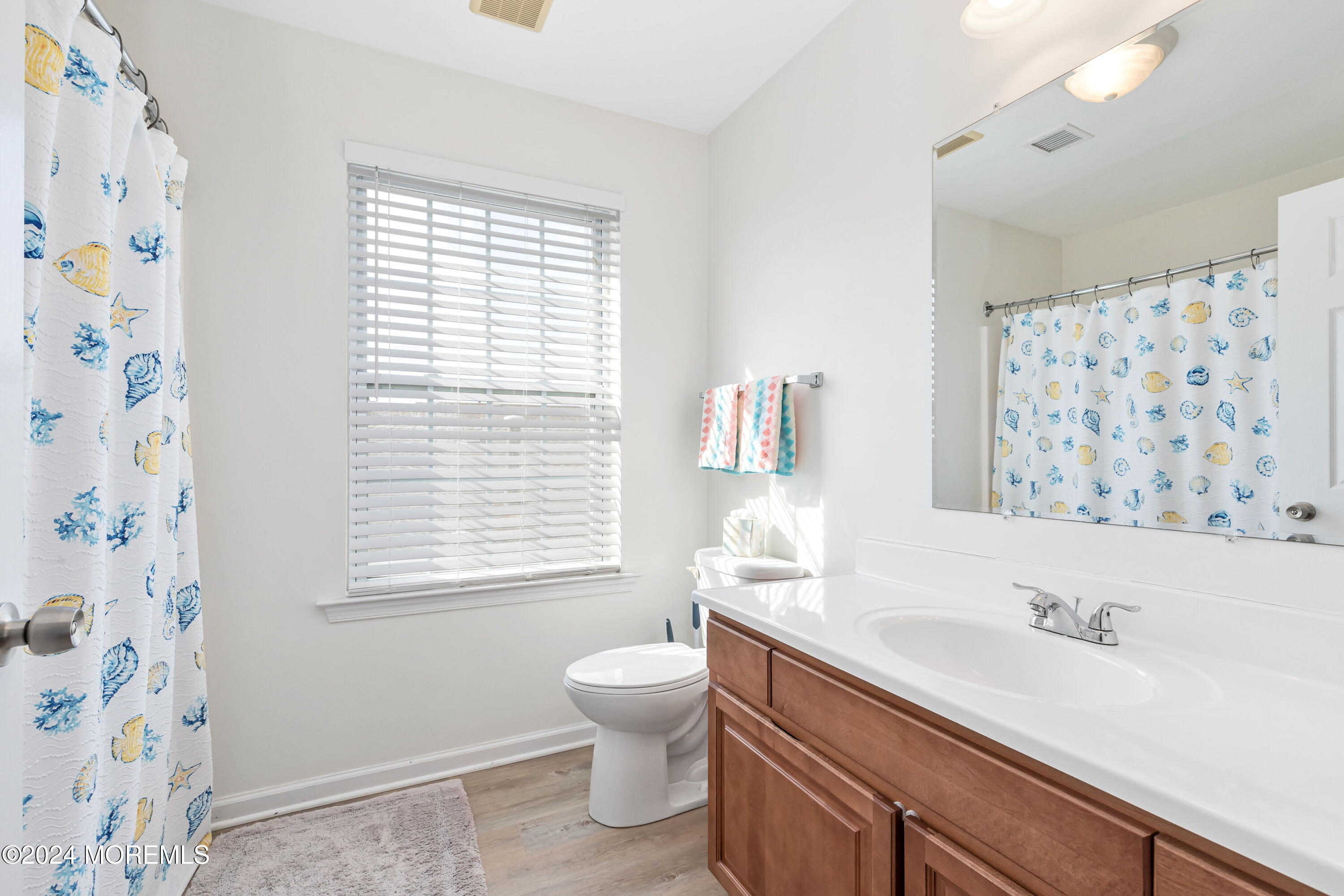 145 Flamingo Road Tuckerton, NJ 08087 - Photo 24 of 43 a bathroom with a granite countertop sink toilet a mirror and shower