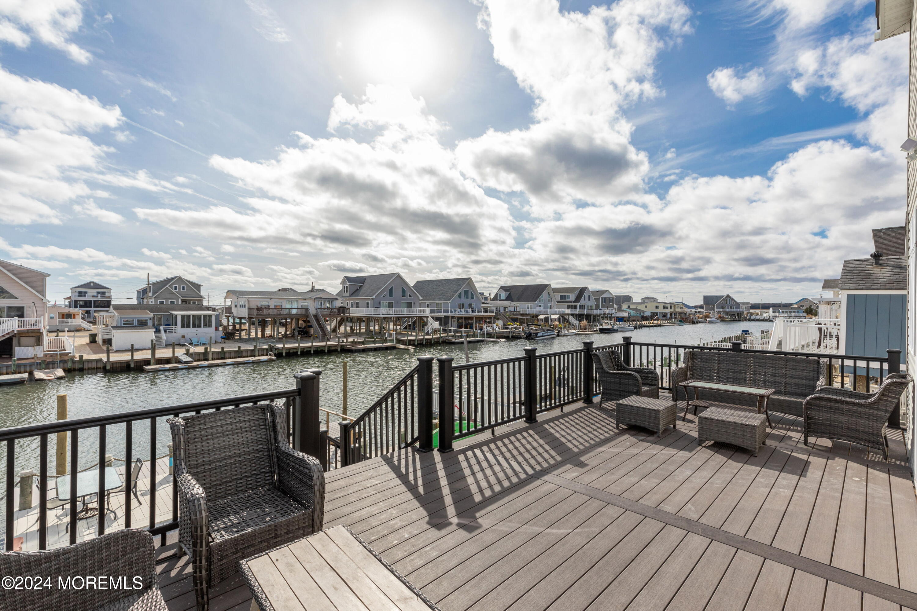 145 Flamingo Road Tuckerton, NJ 08087 - Photo 40 of 43 a view of a terrace with wooden benches
