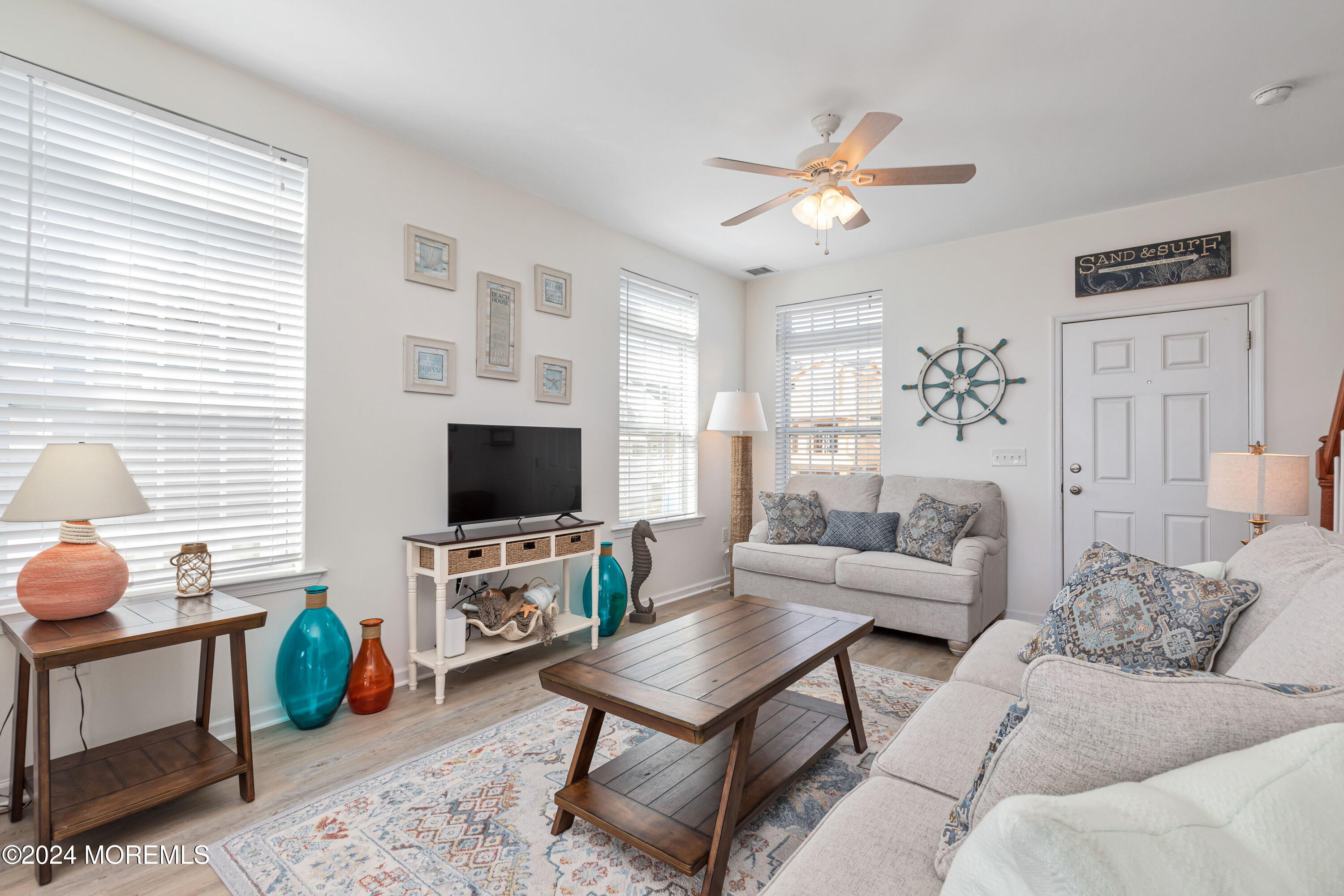 145 Flamingo Road Tuckerton, NJ 08087 - Photo 8 of 43 a living room with furniture a flat screen tv and a window
