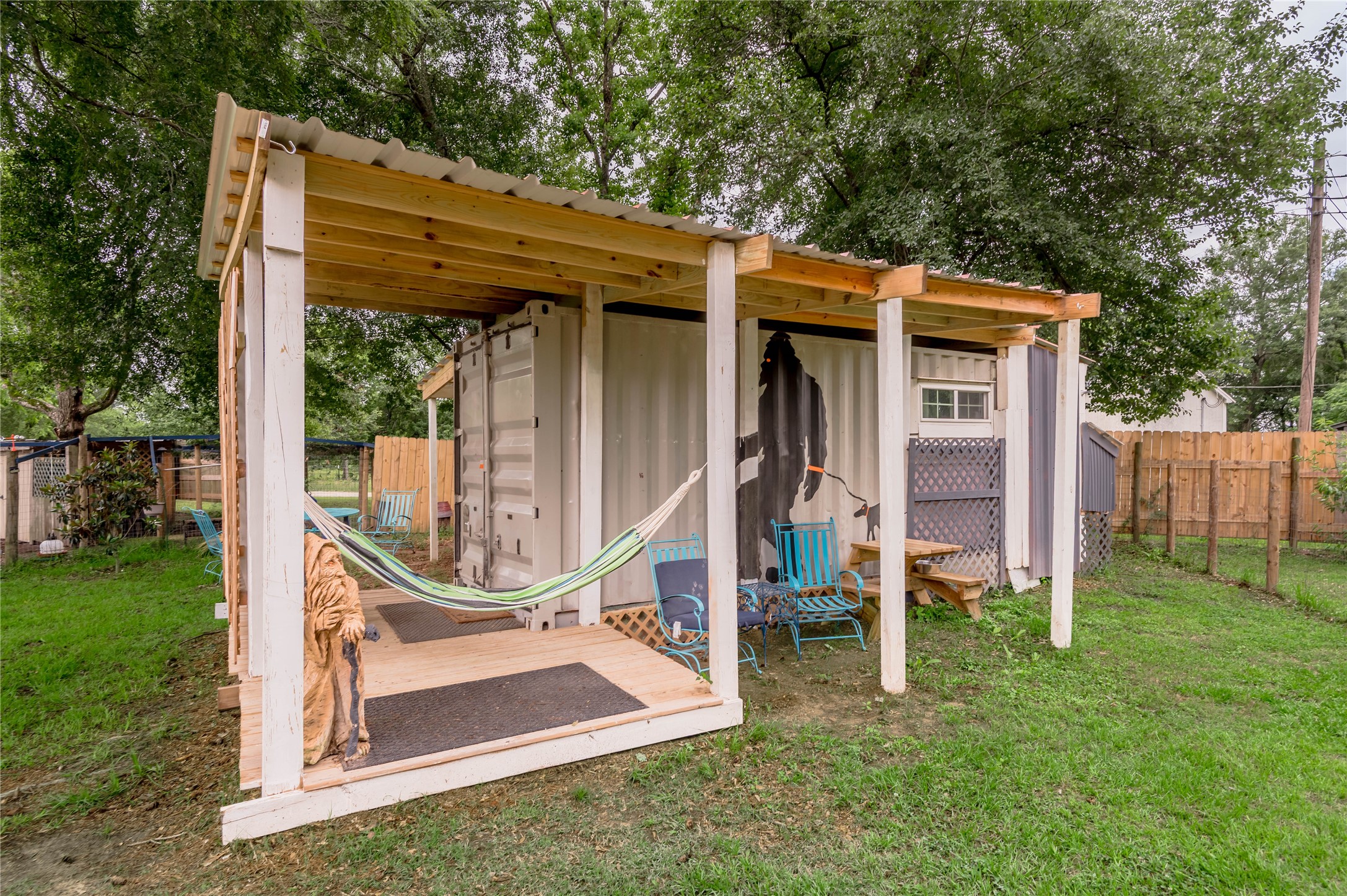 159 Pecan Avenue Groveton, TX 75845 - Photo 21 of 27 a view of a wooden deck and a backyard