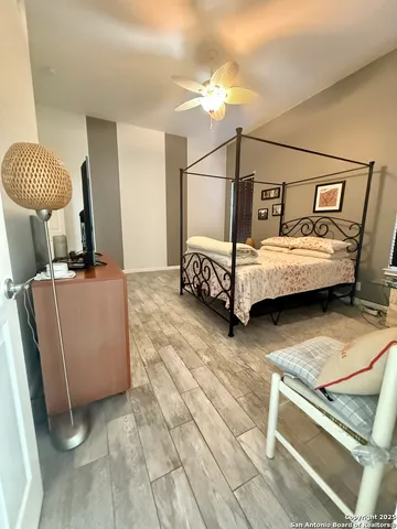 a bedroom with furniture and a window