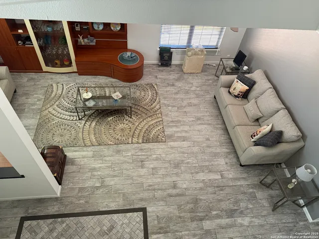 a view of living room with furniture and rug