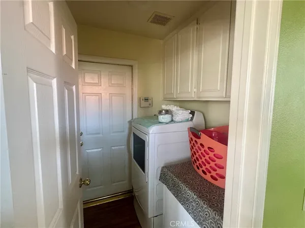 a utility room with a sink washer and dryer
