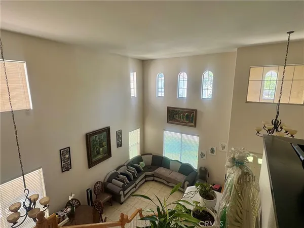 a bedroom with furniture and a lamp