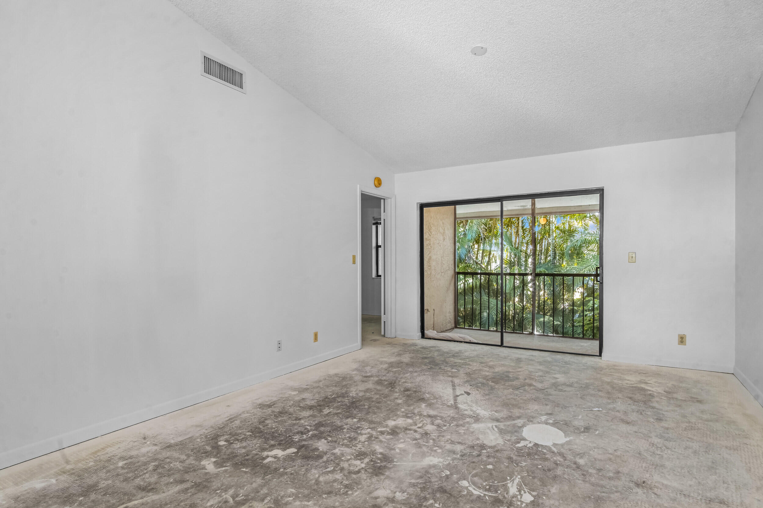 22076 Palms Way, Unit 203 Boca Raton, FL 33433 - Photo 12 of 25 a view of an empty room with a window