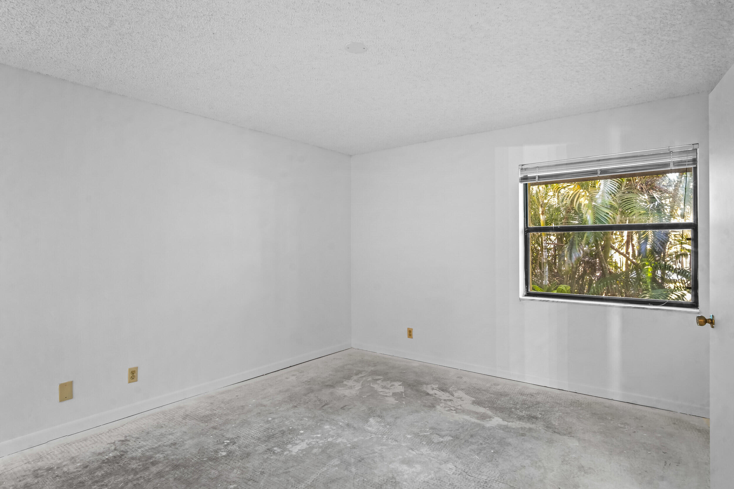 22076 Palms Way, Unit 203 Boca Raton, FL 33433 - Photo 15 of 25 an empty room with windows