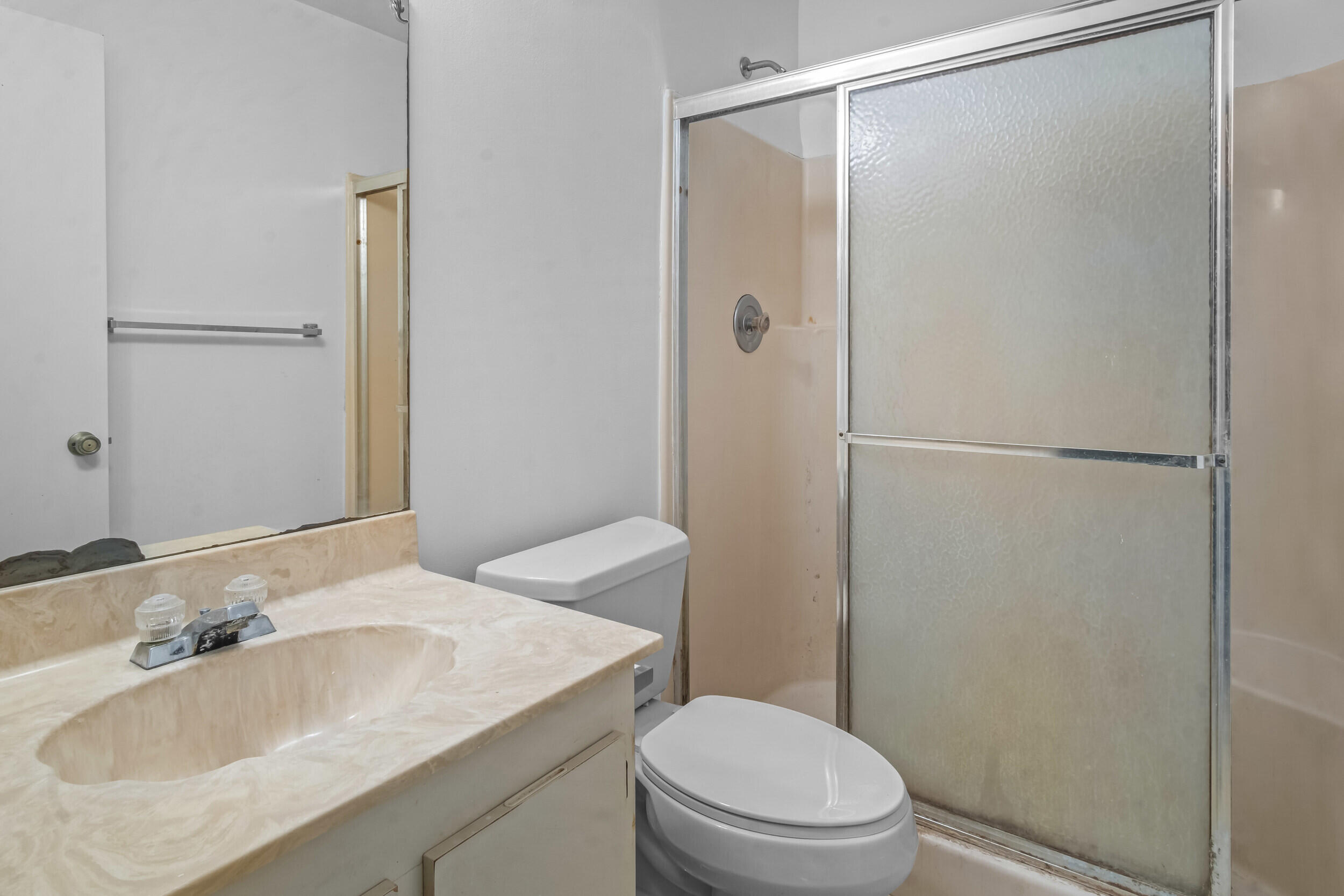 22076 Palms Way, Unit 203 Boca Raton, FL 33433 - Photo 17 of 25 a bathroom with a sink toilet and shower