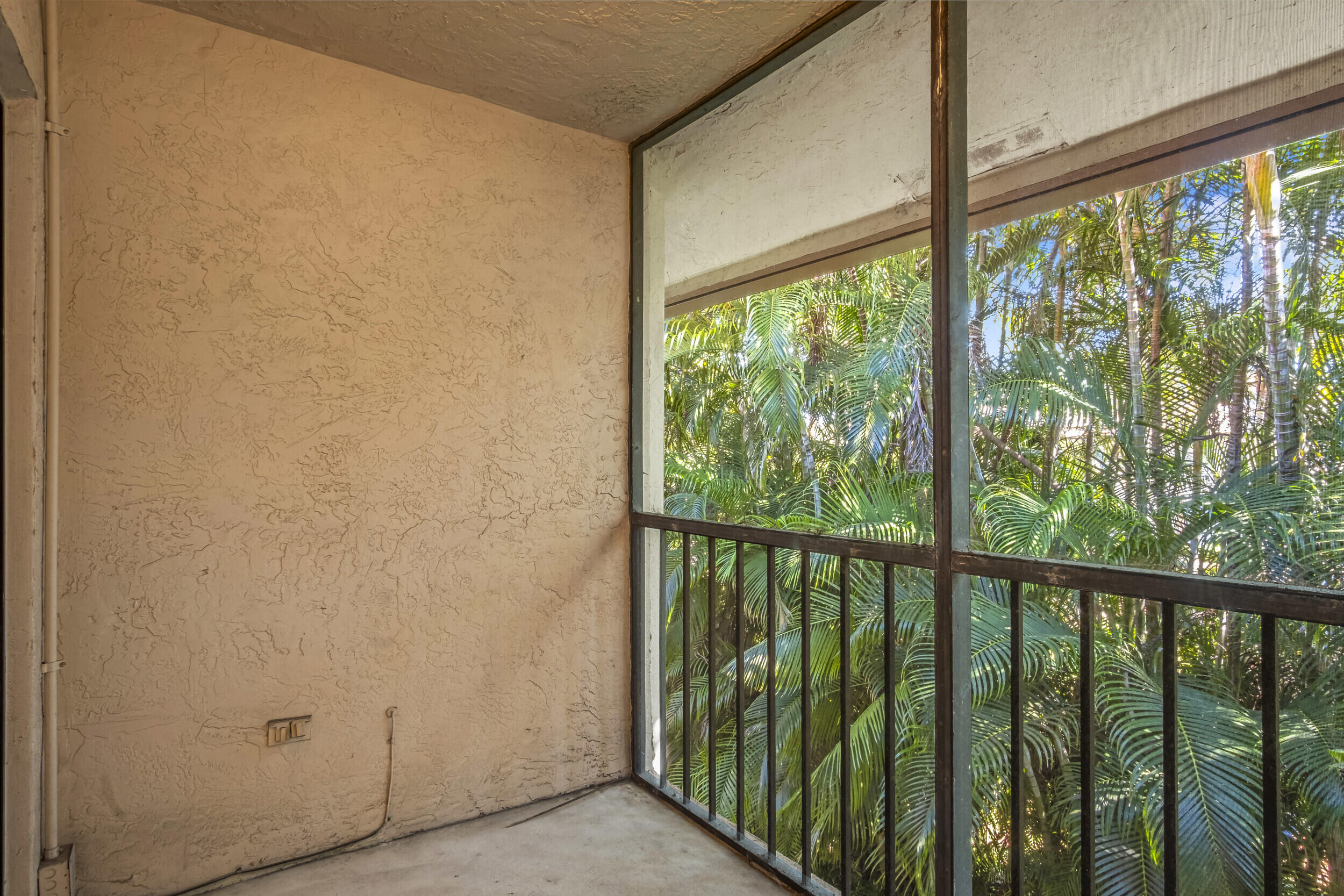 22076 Palms Way, Unit 203 Boca Raton, FL 33433 - Photo 21 of 25 a view of a balcony with wooden floor