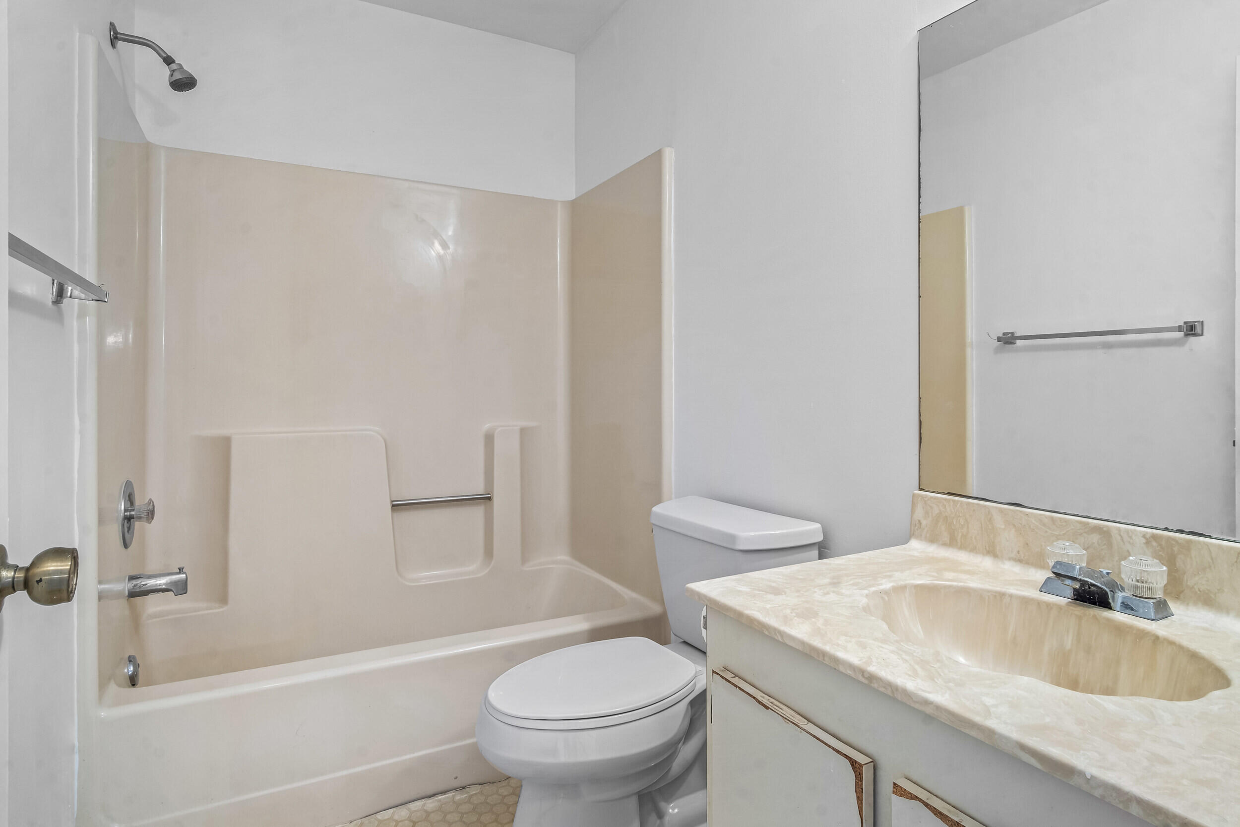 22076 Palms Way, Unit 203 Boca Raton, FL 33433 - Photo 8 of 25 a bathroom with a sink a toilet and shower